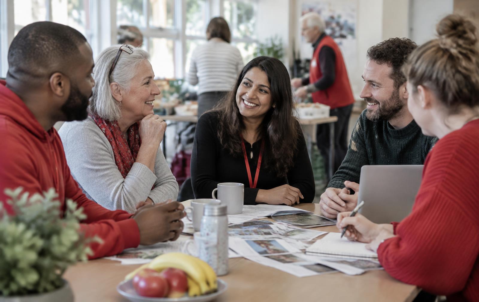 Charity professionals sharing ideas around a table