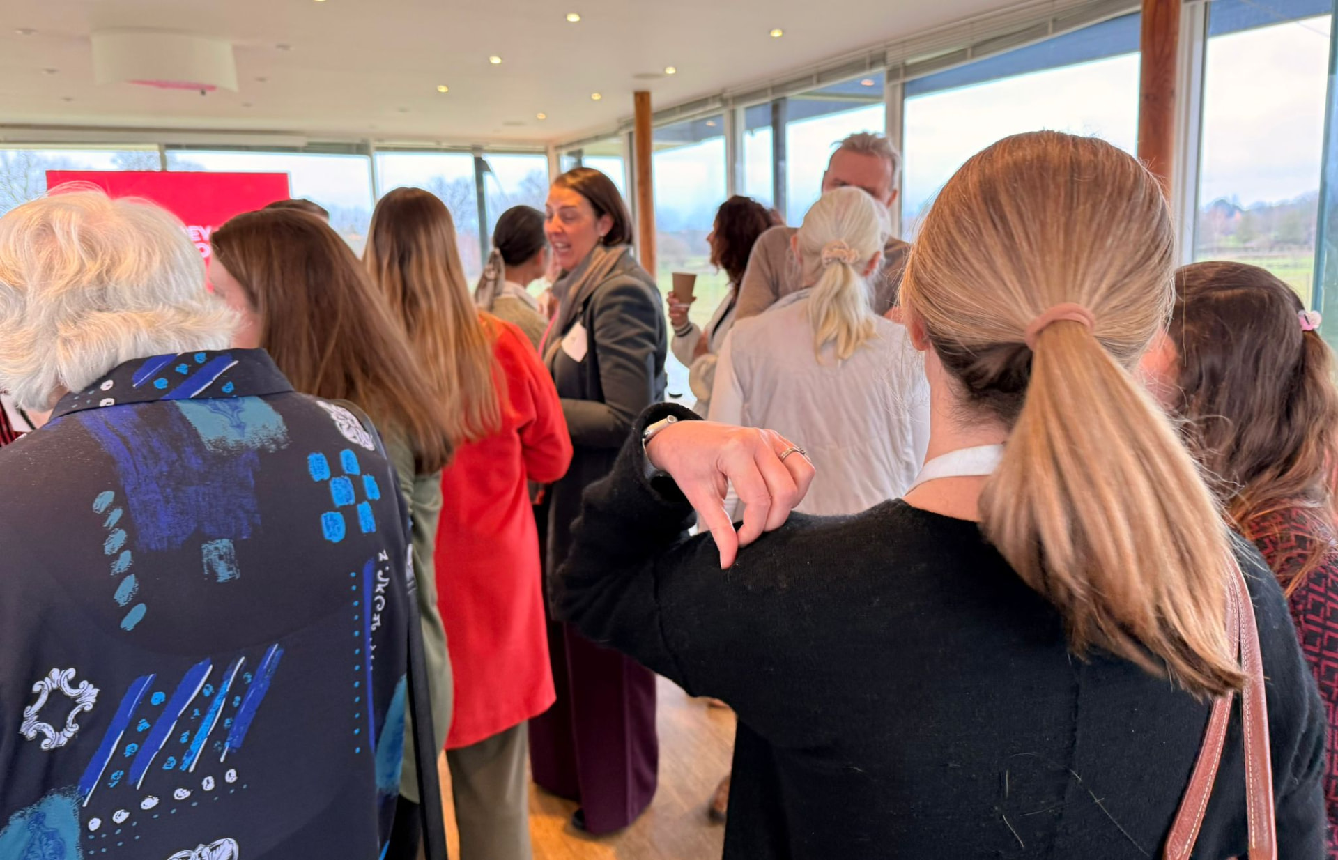 SCN members gathered and listening during a network event